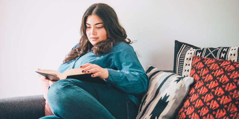 Woman reading book whilst menstruating